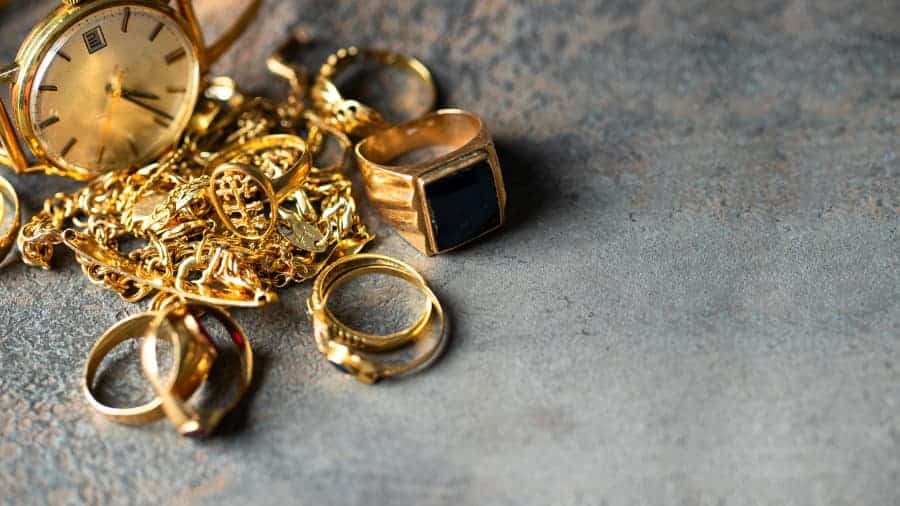 Old and broken jewelry laid out to be recycled