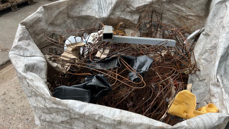 Scrap metal stored in a bag away from water and other elements