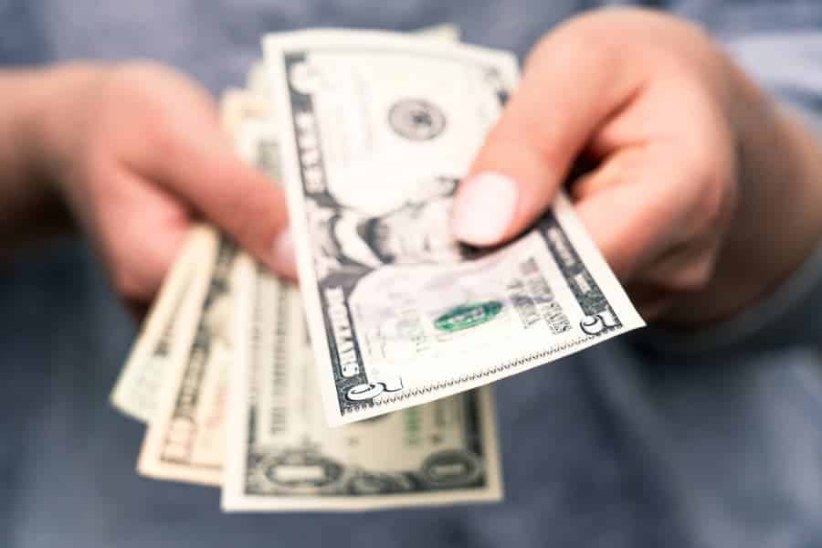Money being exchanged for scrap metal