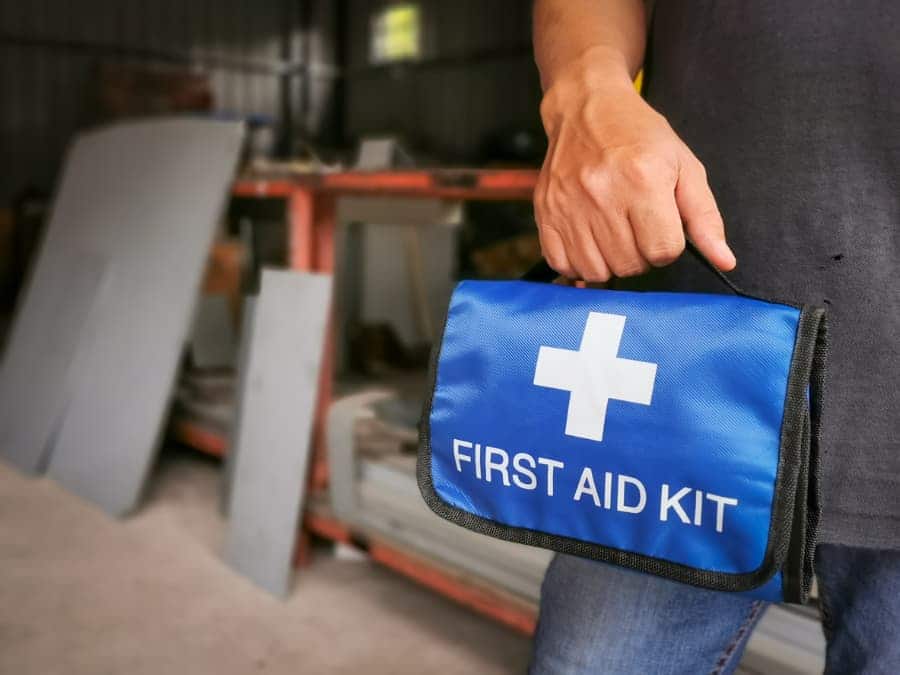 Scrapper holding first aid kit